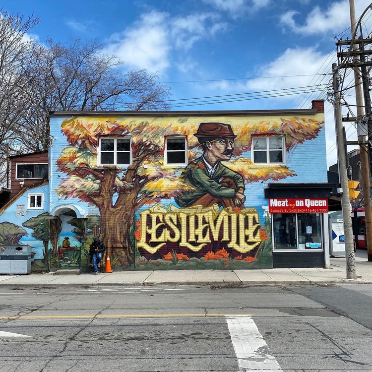 Leslieville mural on Queen Street East, Toronto — large “LESLIEVILLE” lettering and neighbourhood landmark art